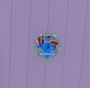 Example of a badge/button used as decoration on a wall.